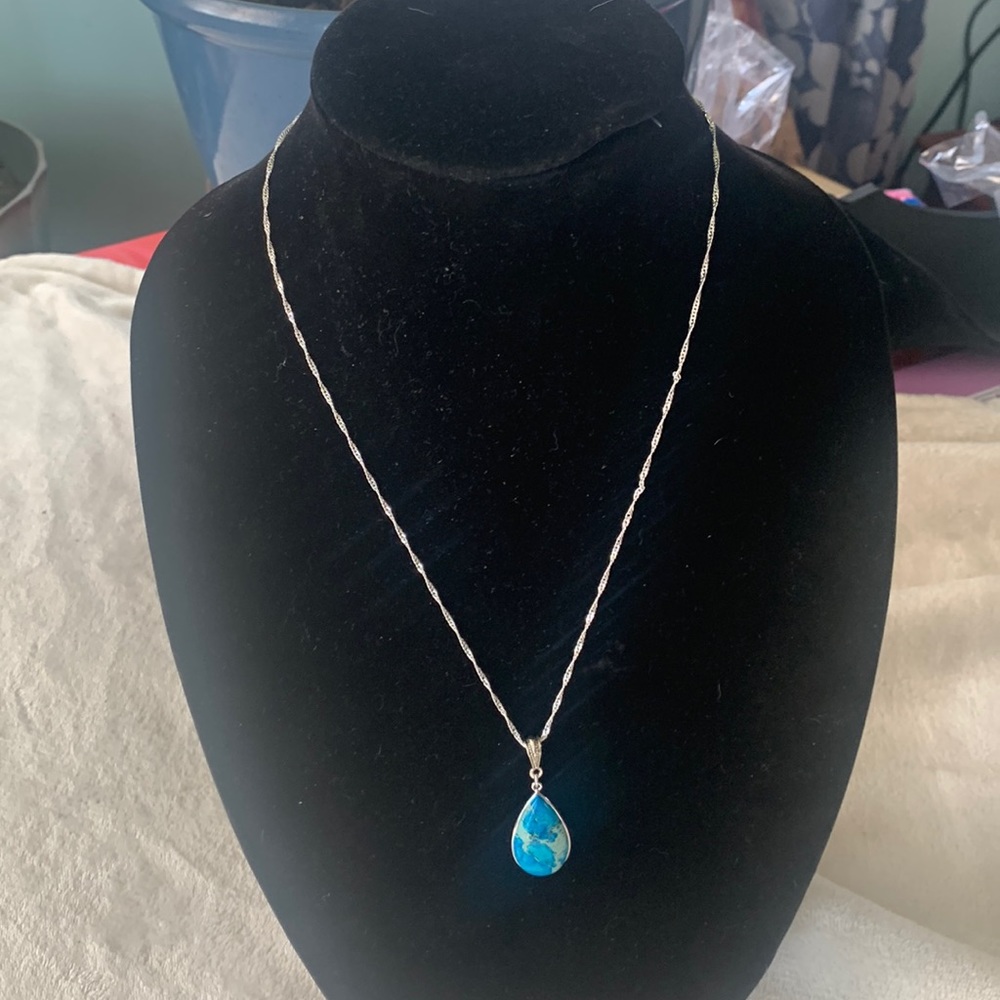 Silver necklace with blue stone pendant